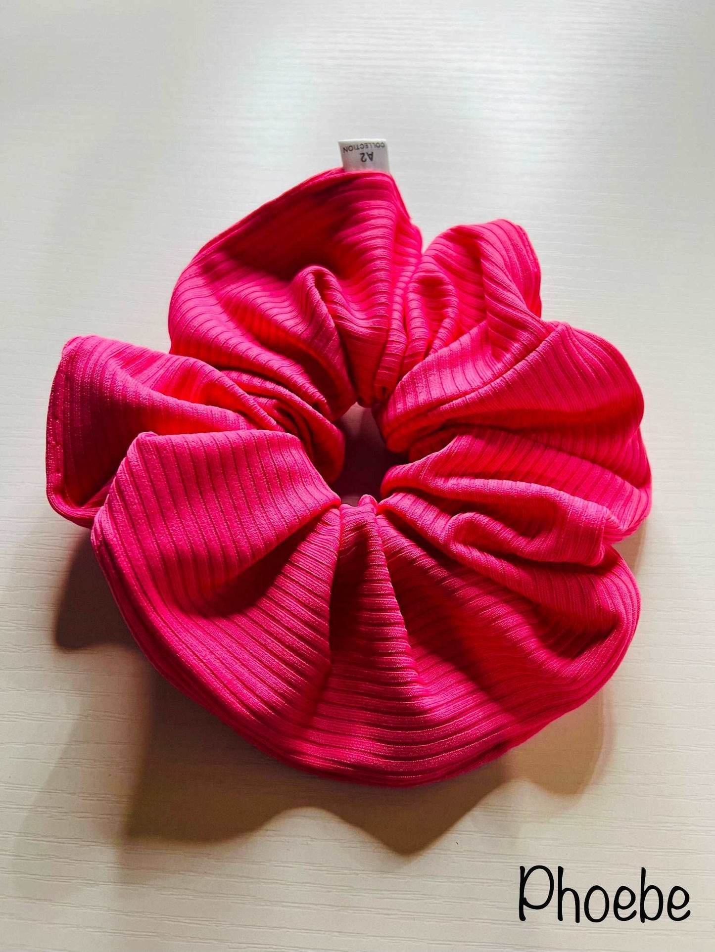 Embrace sustainable style with our eco-conscious scrunchies, thoughtfully crafted from recycled poly ribbed fabric